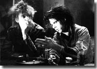 Blixa and Nick Cave playing dice, (first day of both together infront of camera), 30.april 1986, in "Clip", Yorkstraße, Berlin